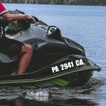 Jet ski registration numbers in white